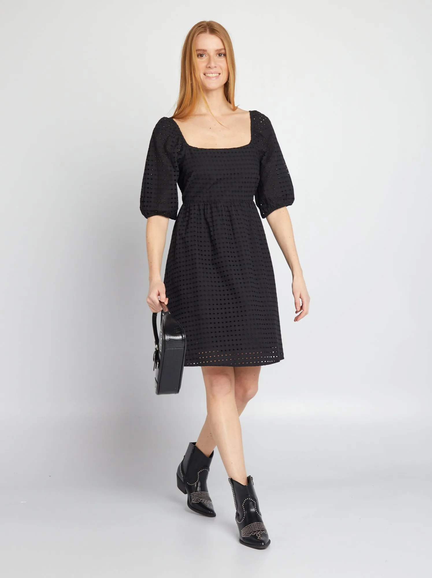 Black puffed dress with pierced embroidery