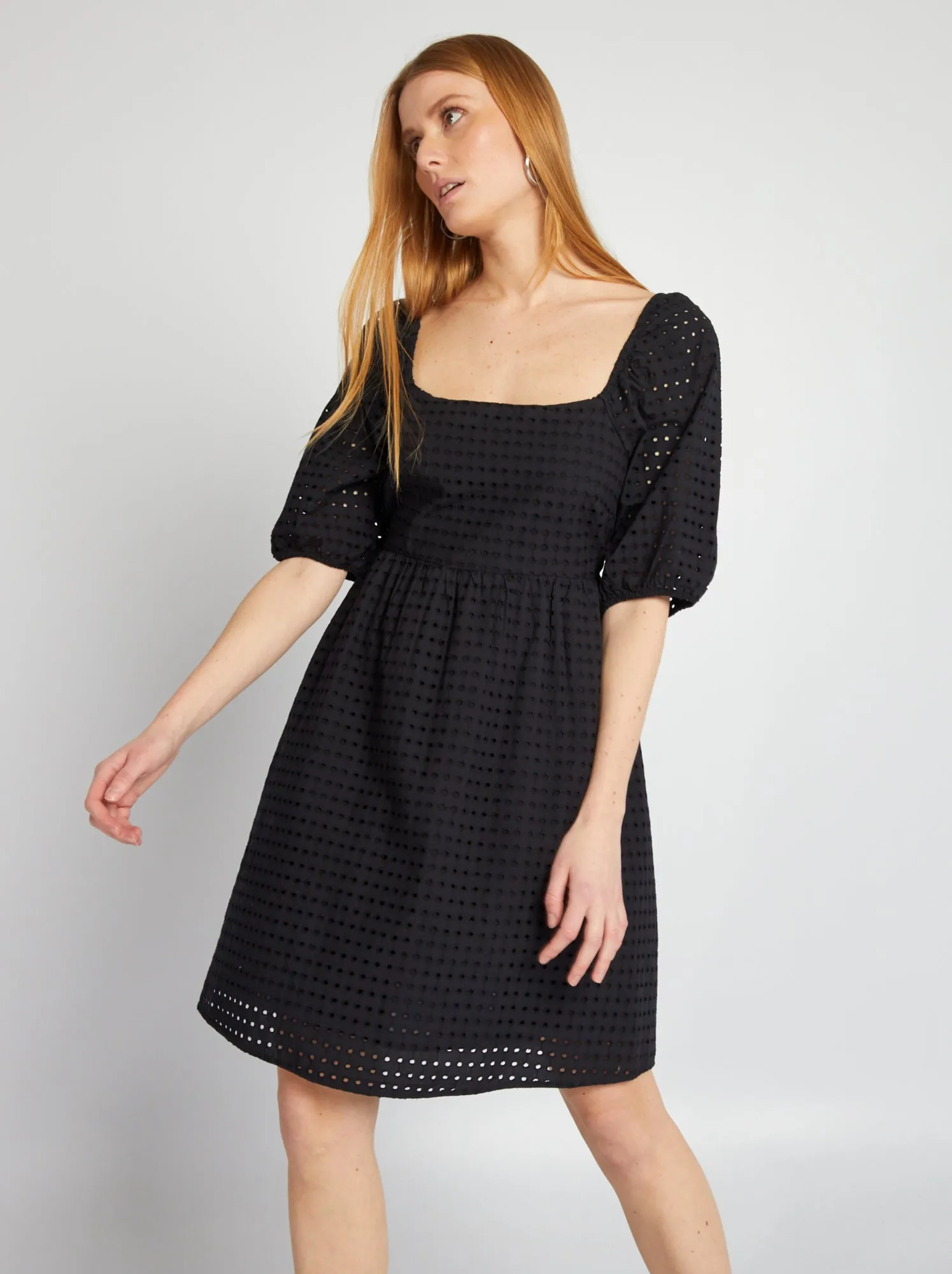 Black puffed dress with pierced embroidery