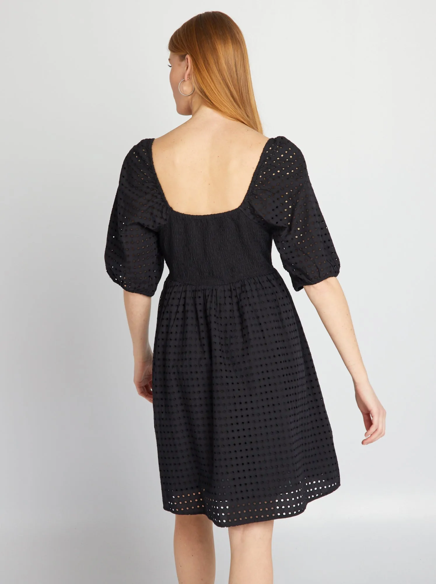 Black puffed dress with pierced embroidery