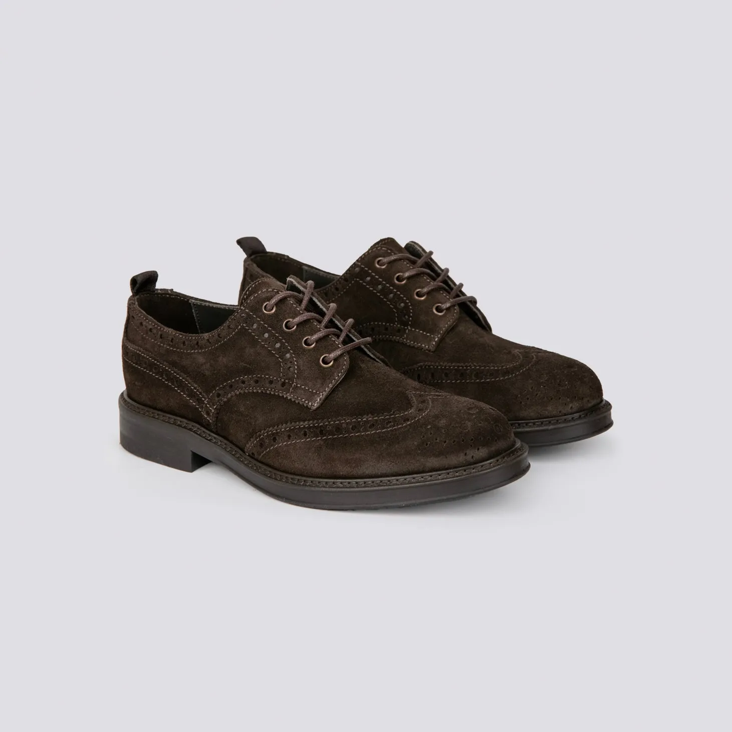 Brown suede oxford shoes with brogue detailing.
