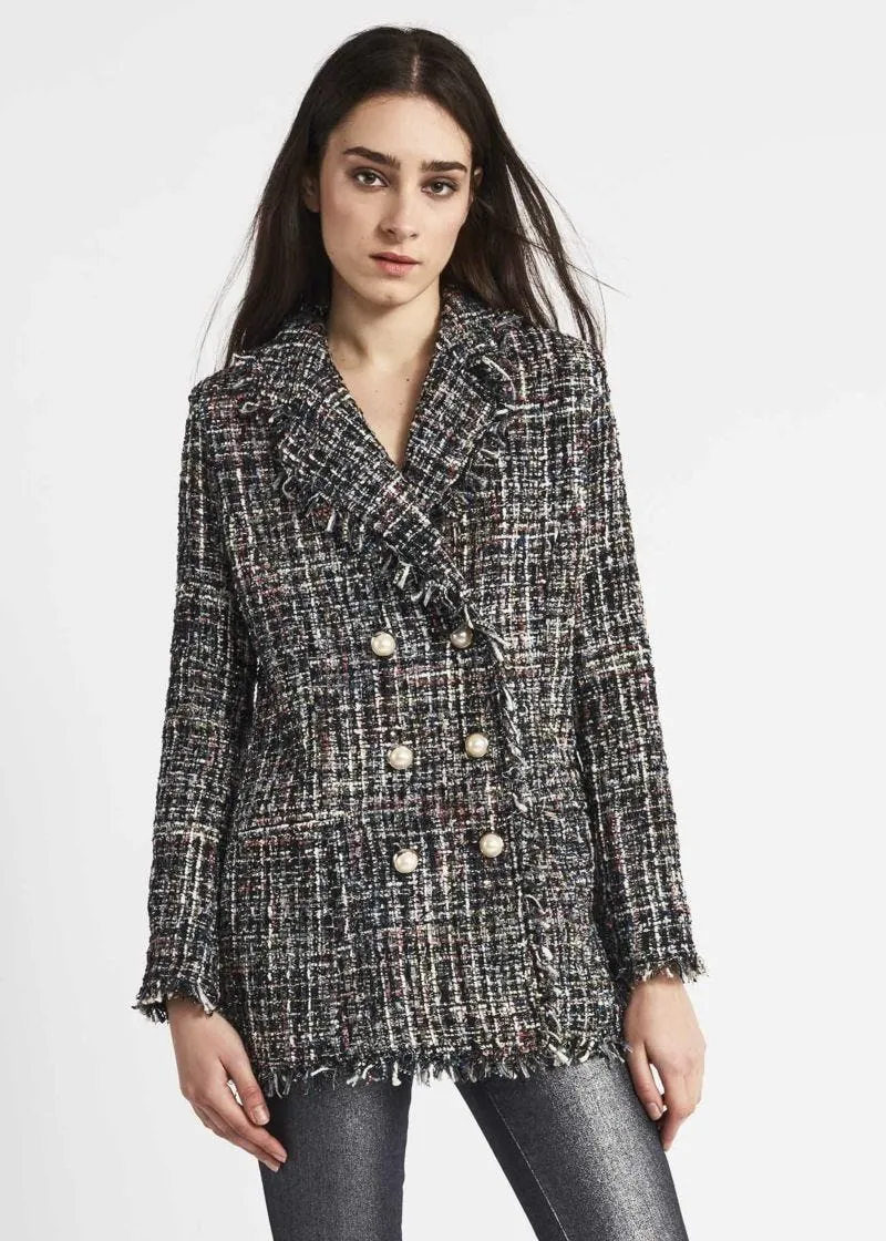 Double-breasted jacket with fringed edges.