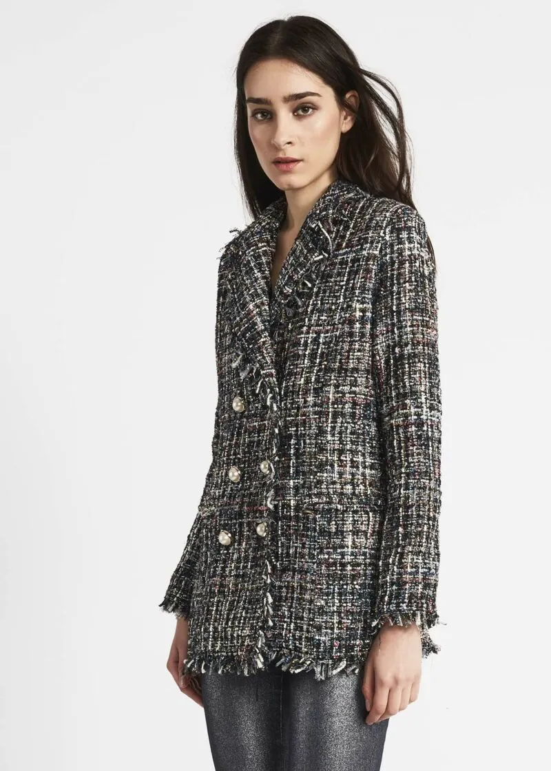 Double-breasted jacket with fringed edges.