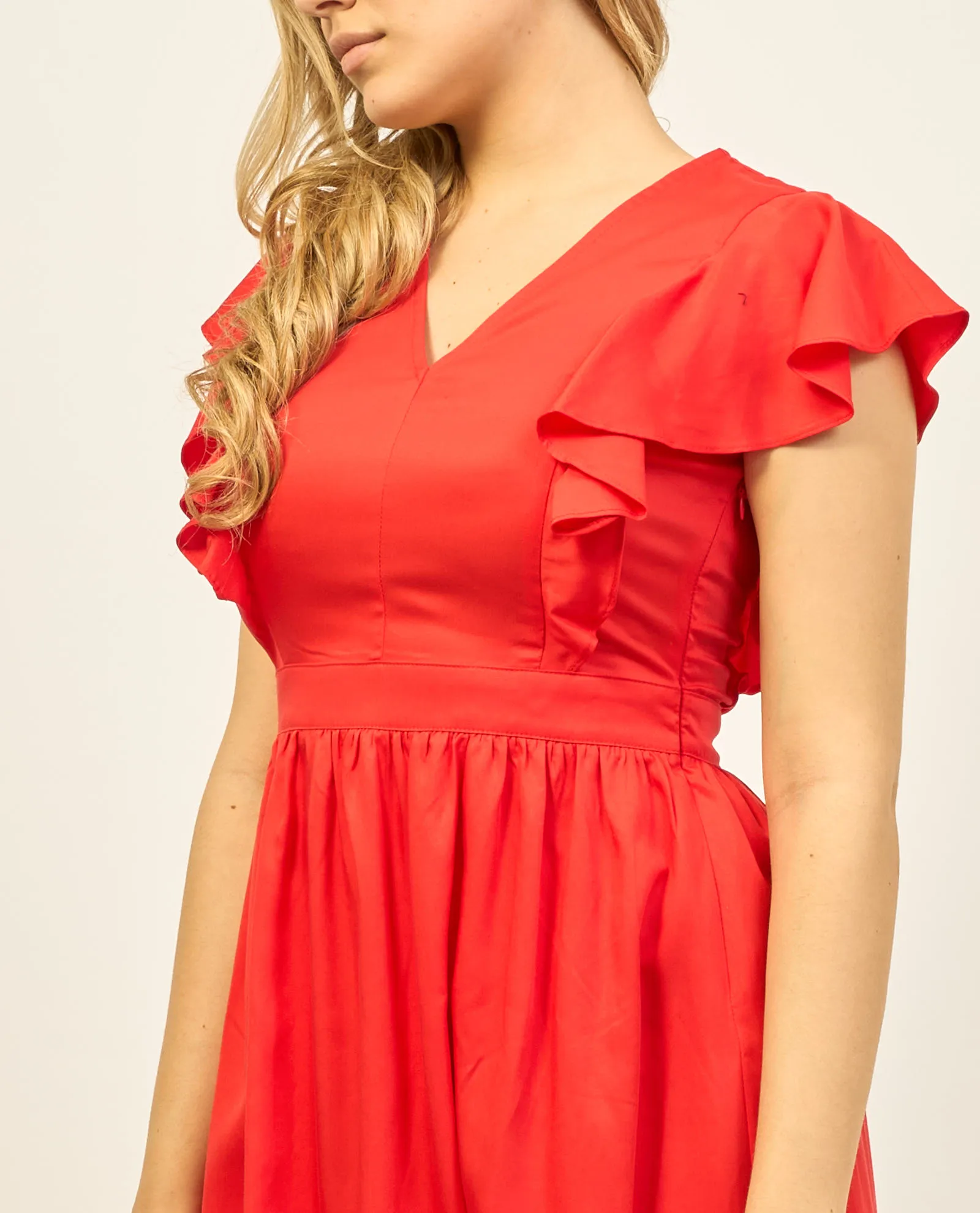 Gaudi short dress with V neckline and ruffle.