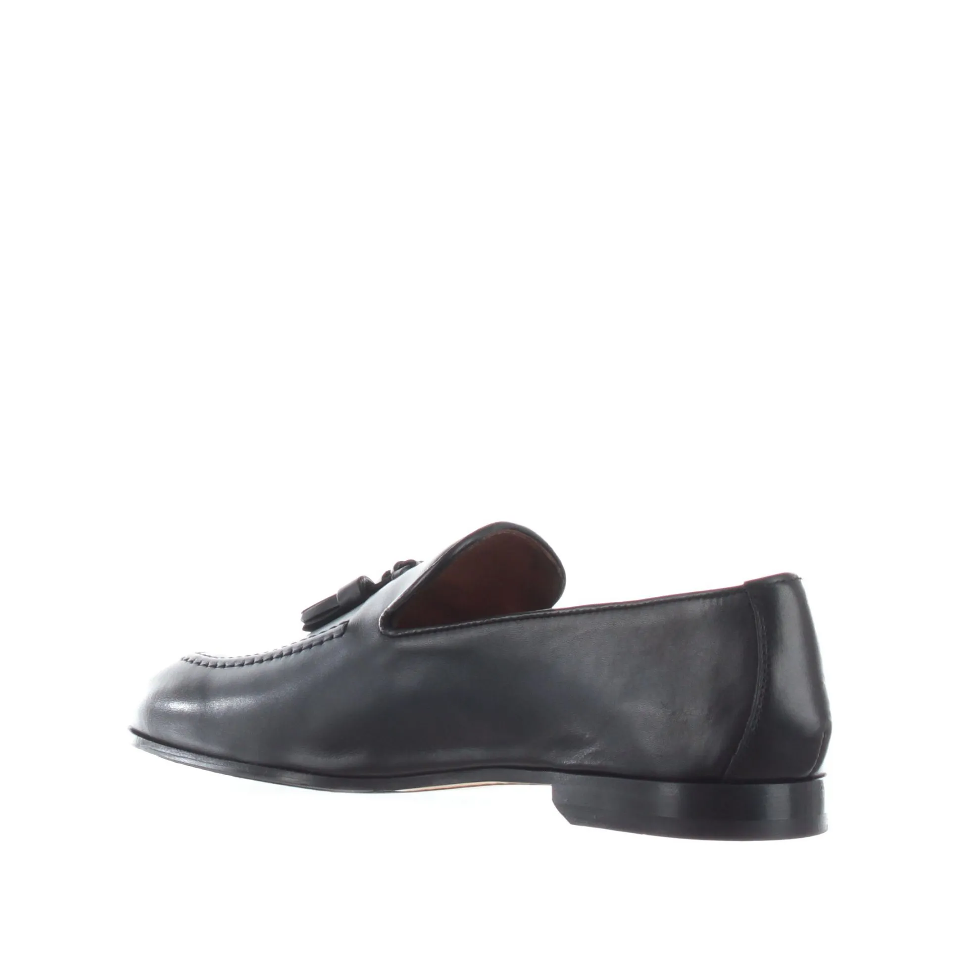 Leather loafers with tassels.
